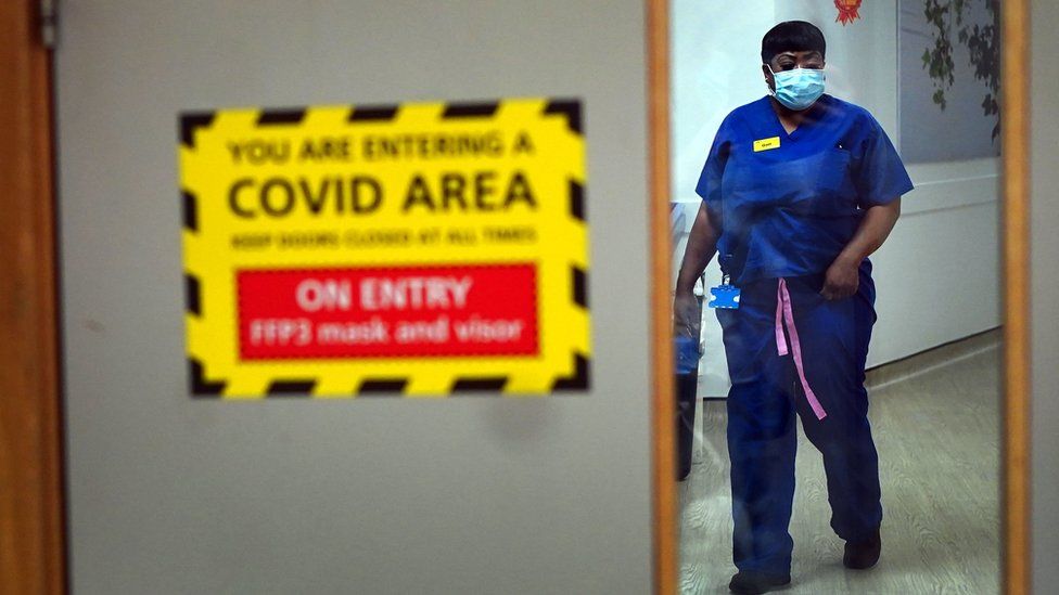 A nurse walks through a Covid ward at King"s College Hospital, in south east London