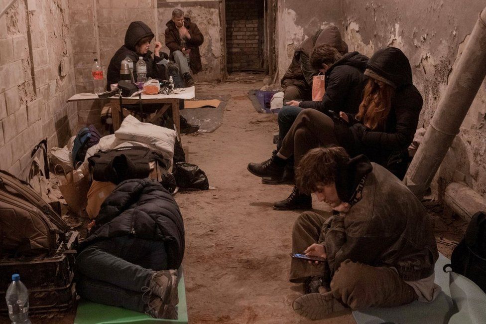 Kyiv residents take shelter in the basement of an apartment building (27 February 2022)