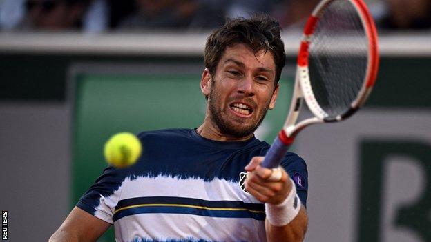 Cameron Norrie hits a return in his French Open defeat by Karen Khachanov