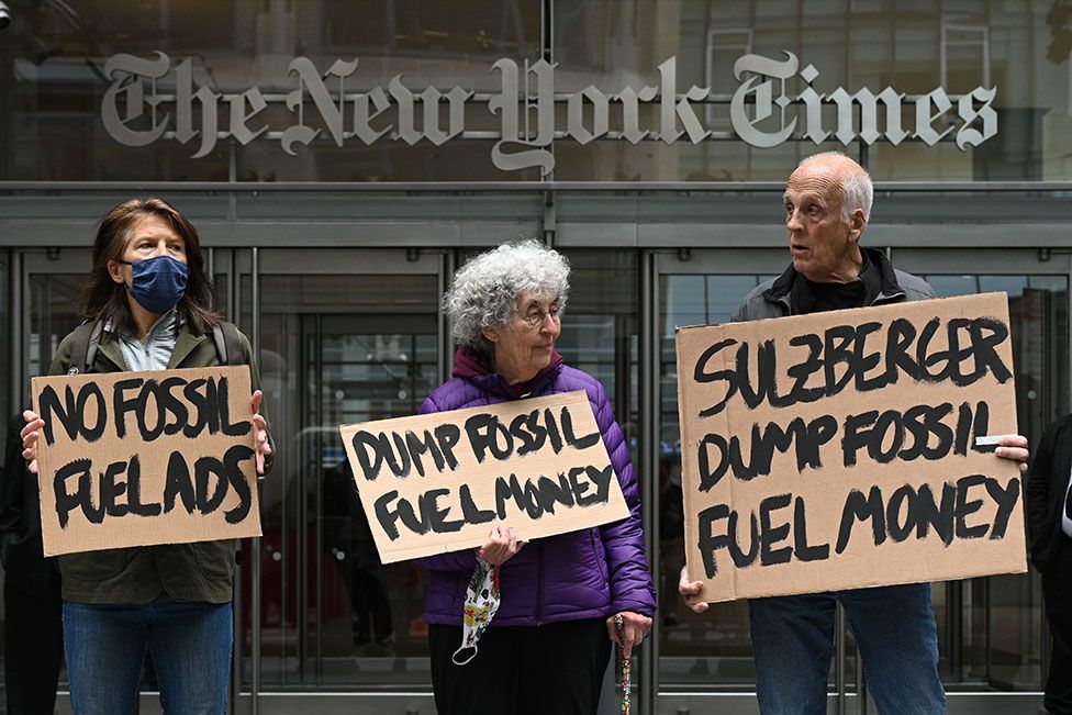 Environmental protesters in front of the New York Times building in New York, US, on 21 April 2022, the day before Earth Day.