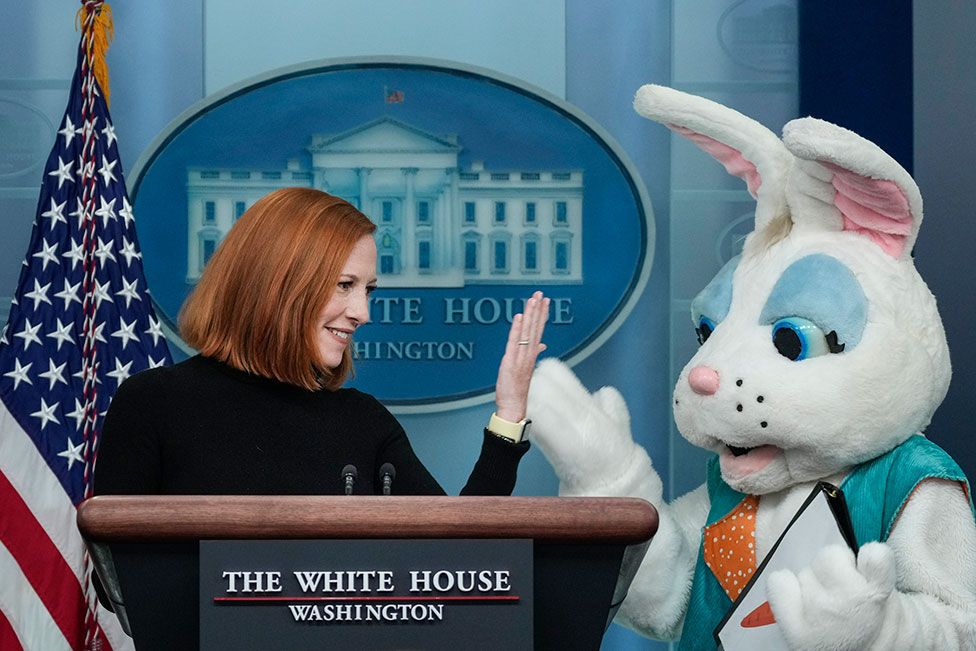 An Easter Bunny stands next to White House press secretary Jen Psaki as she delivers the daily briefing in the Brady briefing room of the White House in Washington, DC, US, on 18 April 2022